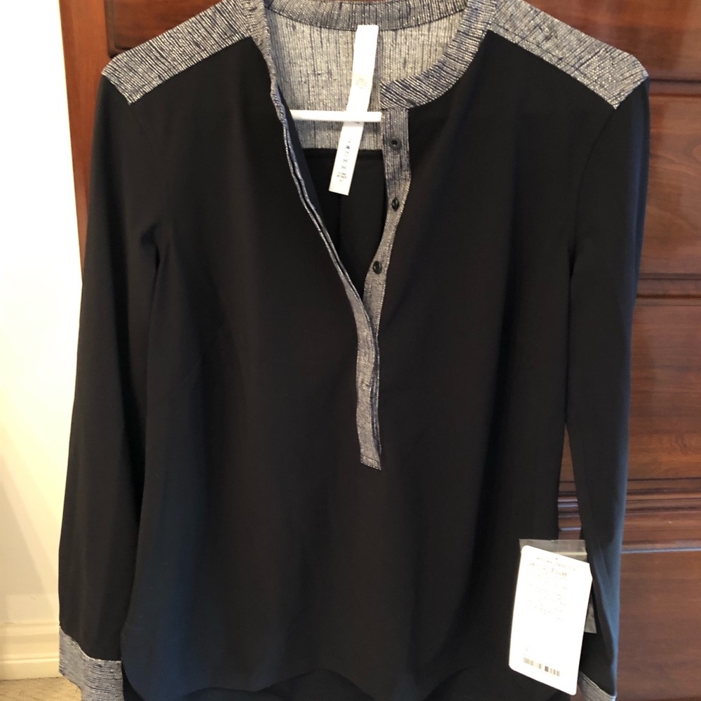 Never worn with tags Lululemon Black and grey Get it On Blouse